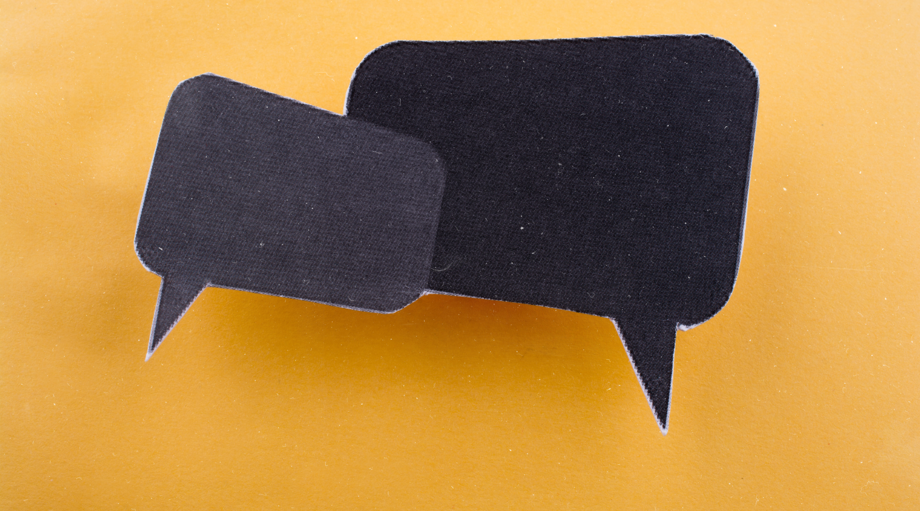 Speech bubbles on top of a yellow background